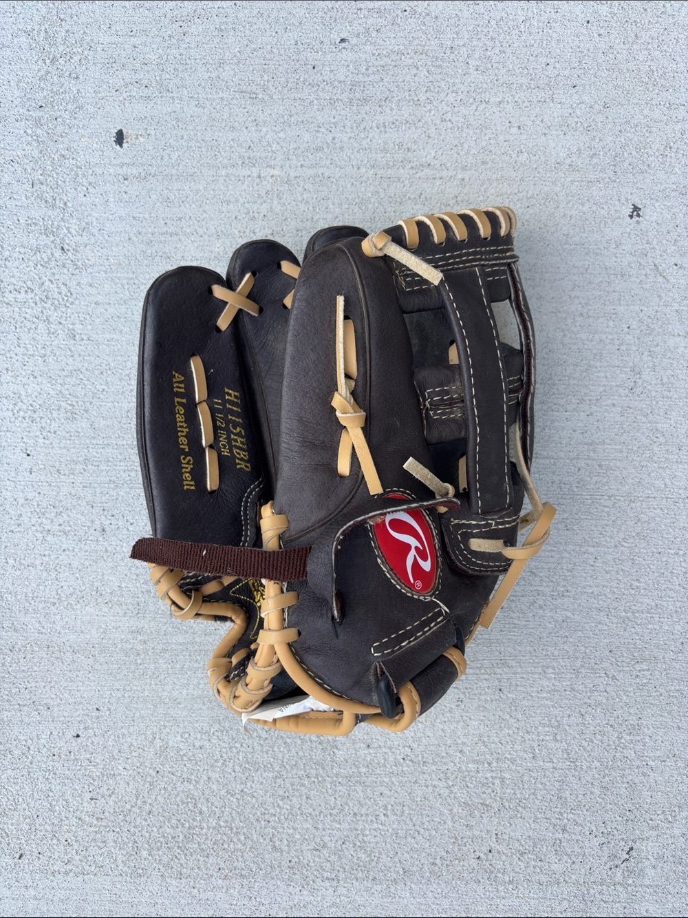 Rawlings black and tan leather baseball glove with gold logo